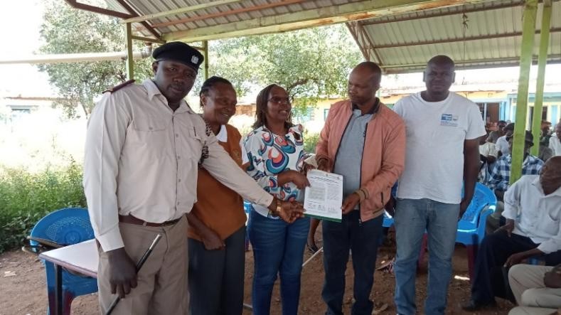 Sharing fact sheets to Member County Assembly (MCA), community administrator and farmers in one of the wards in Embu