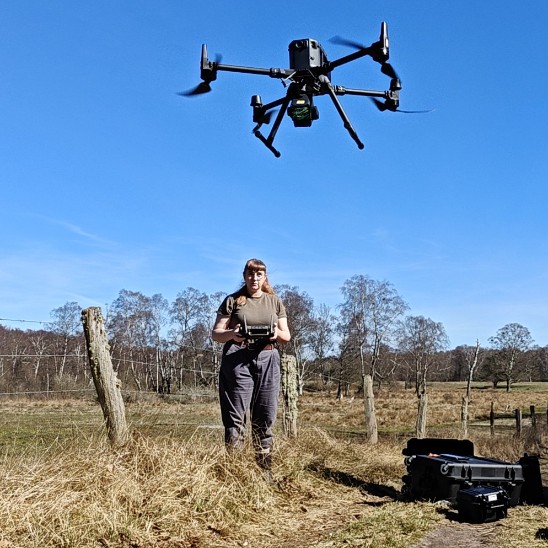 Sara flying drone. Photo. 